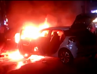 Parked car catches fire