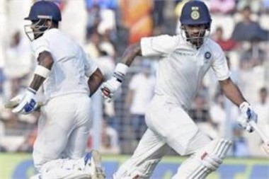 Dhawan, Rahul frustrate Sri Lanka with fighting fifties