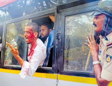 PFI activists caned for pelting cops with stones