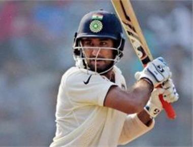 Vijay, Pujara shine after India bowl England out for 400